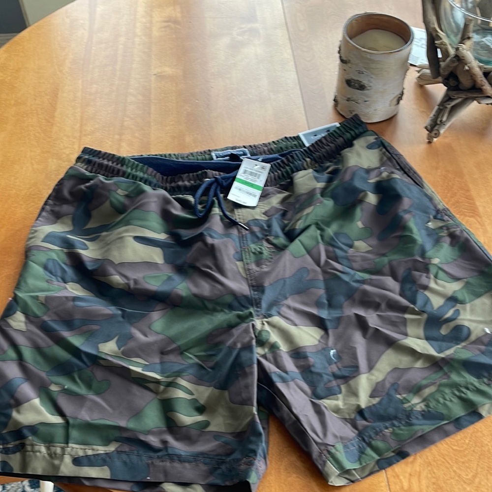 Mens swim shorts brand new!velcro back pocket. Lined shorts. Quick dry. Camo .